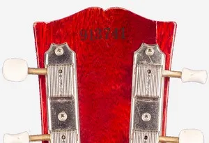 Gibson serial number stamped with ink on the back of the headstock