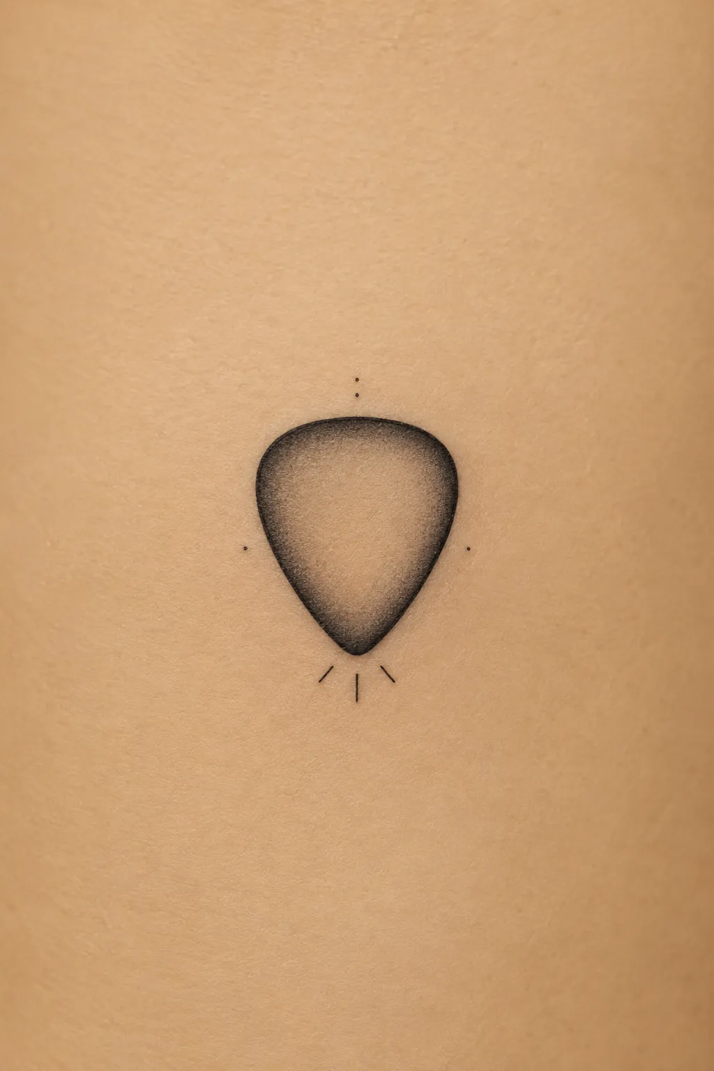 guitar pick tattoo 07
