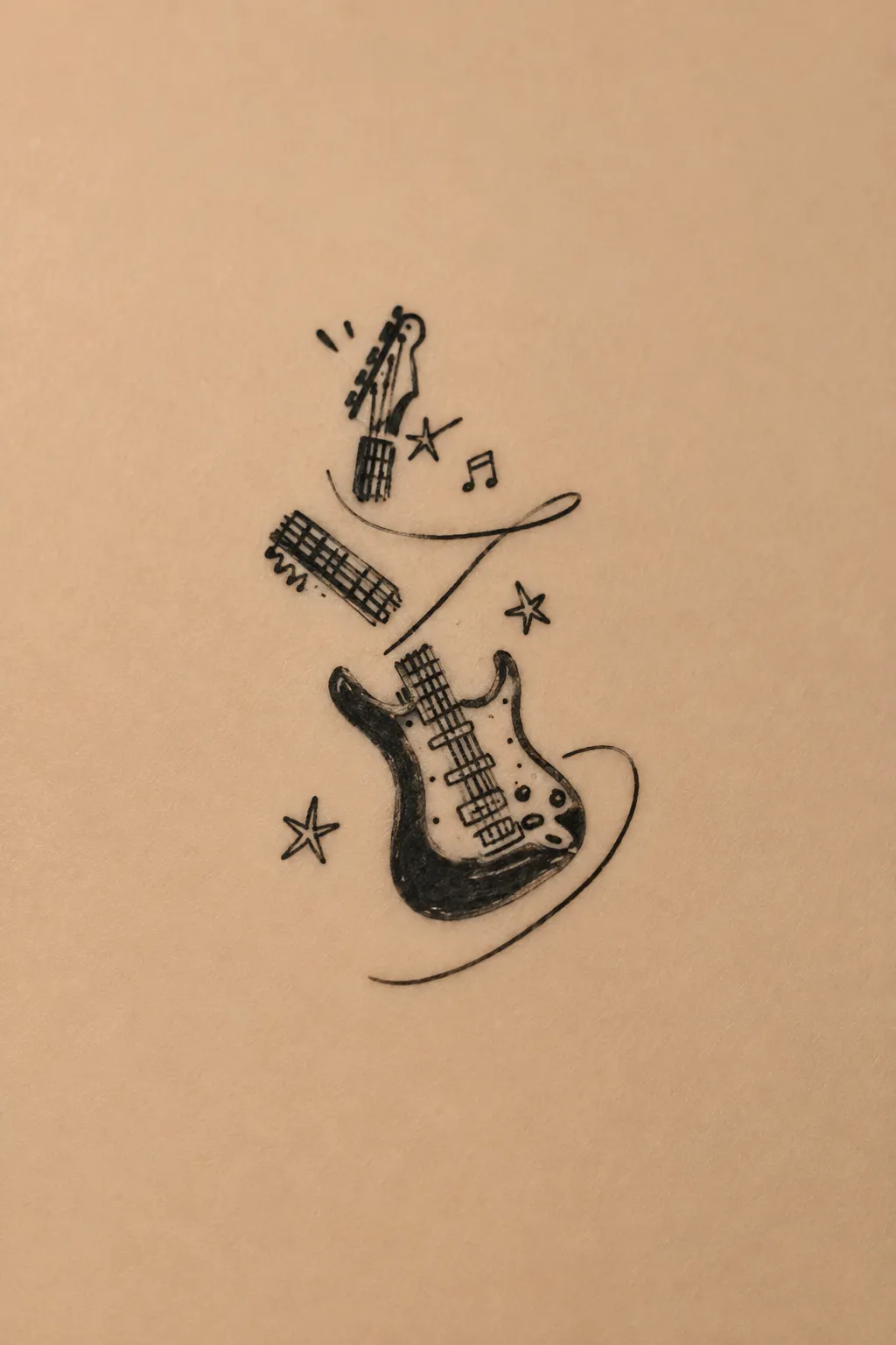 small guitar tattoo 05